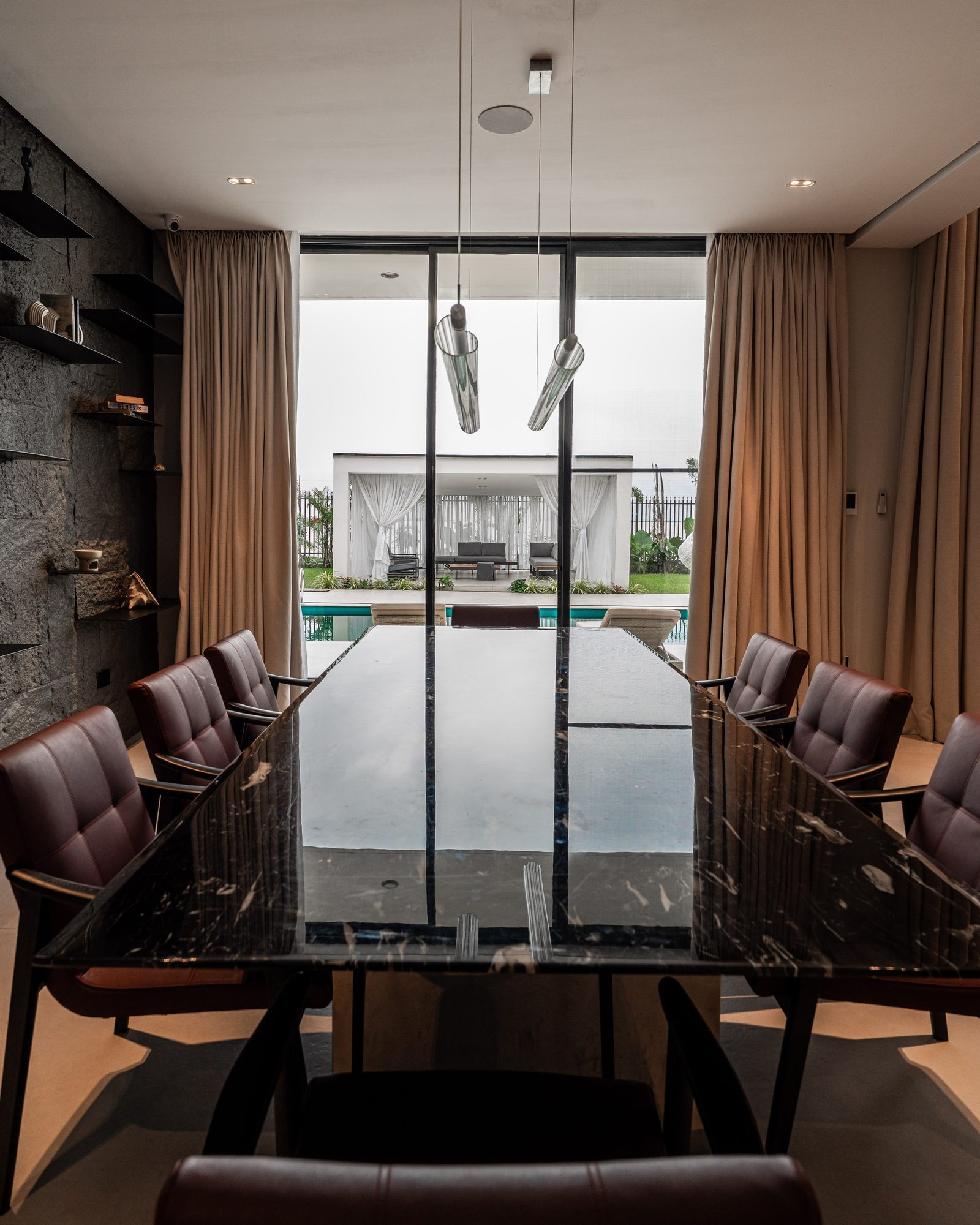 From the dining table, through the glass doors to the pool