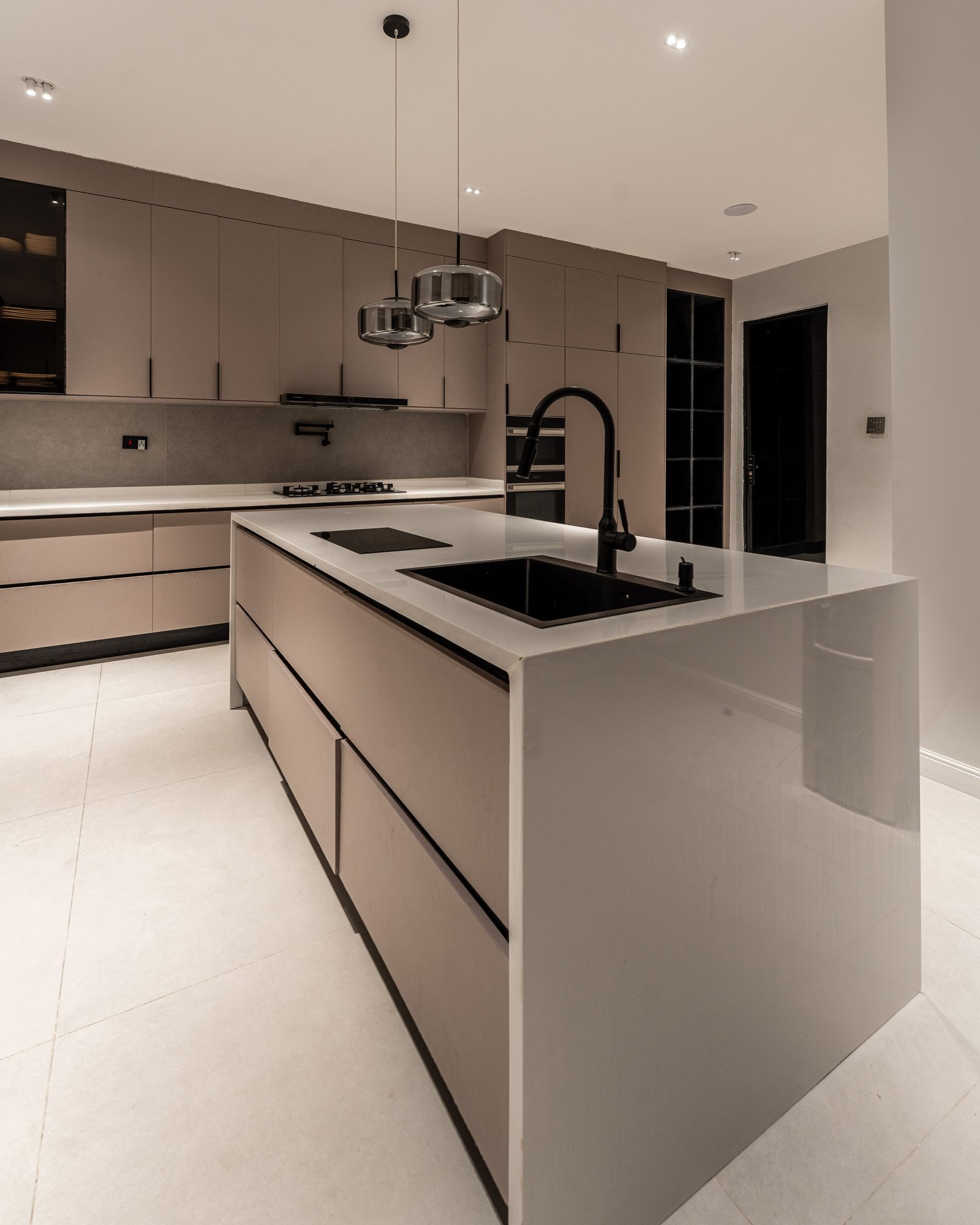 The kitchen island and handleless cabinetry